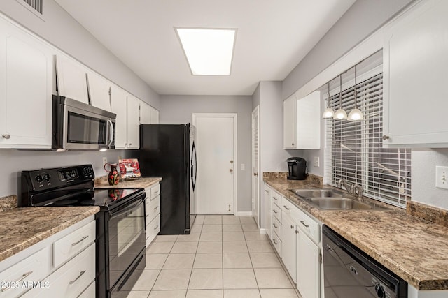 kitchen featuring visible vents, hanging light fixtures, white cabinetry, a sink, and black appliances