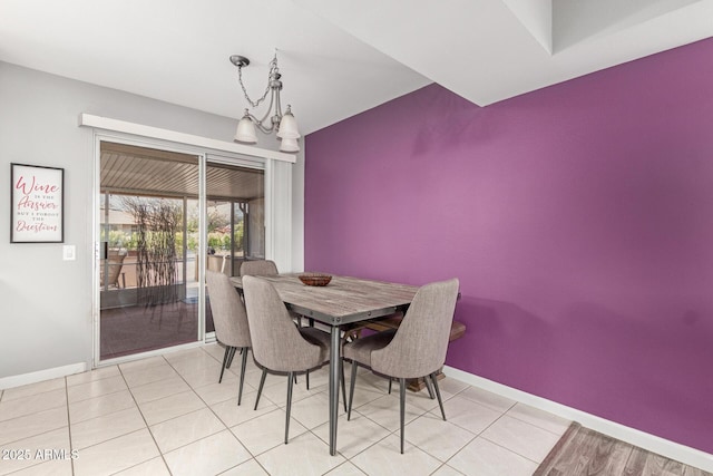 dining area featuring baseboards and light tile patterned floors