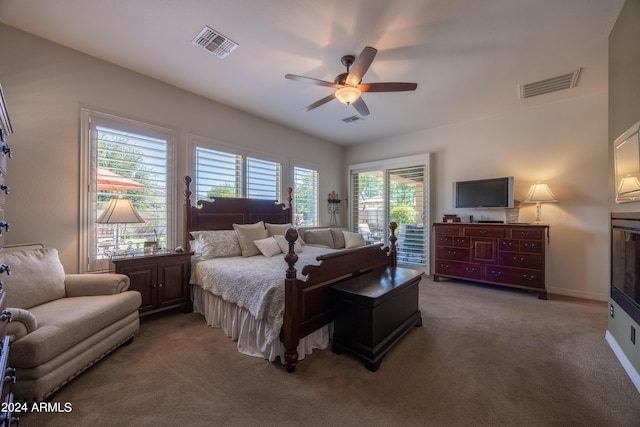 bedroom with multiple windows, carpet floors, and ceiling fan