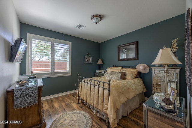 bedroom with hardwood / wood-style floors