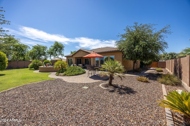 exterior space featuring a patio area and a lawn