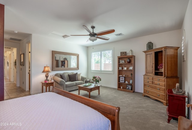 bedroom with light colored carpet and ceiling fan