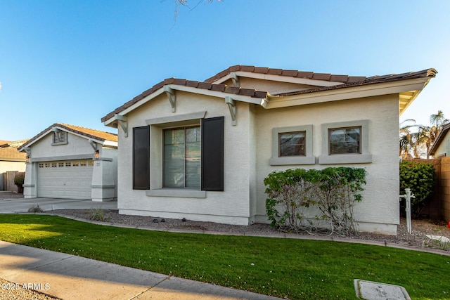 view of front of property featuring a garage and a front yard