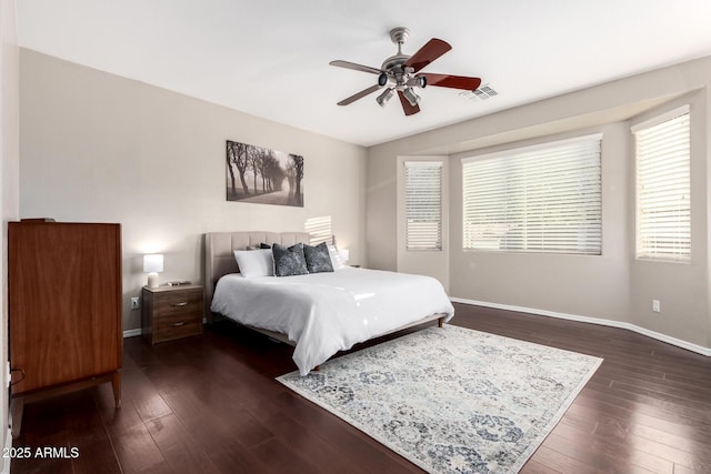 bedroom featuring ceiling fan and dark hardwood / wood-style flooring