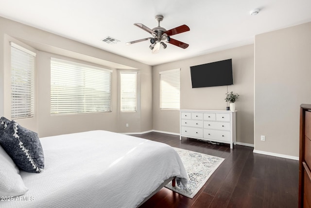 bedroom with dark wood-type flooring and ceiling fan