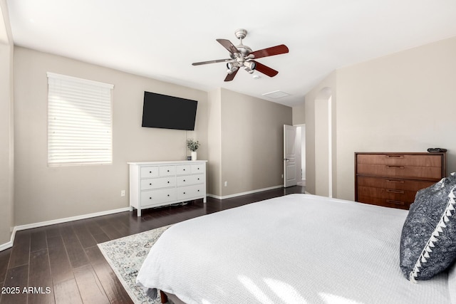 bedroom with dark wood-type flooring and ceiling fan