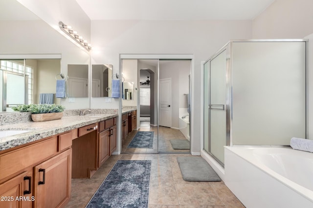 bathroom featuring vanity, separate shower and tub, and tile patterned floors