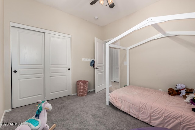 bedroom featuring light colored carpet, a closet, and ceiling fan