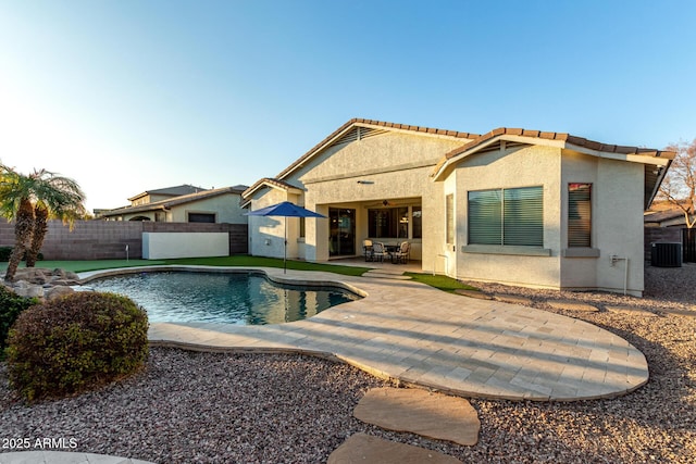 view of pool featuring central AC and a patio