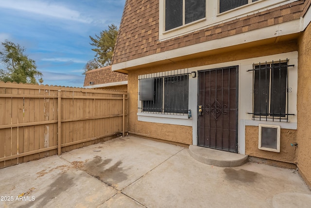 doorway to property with a patio area