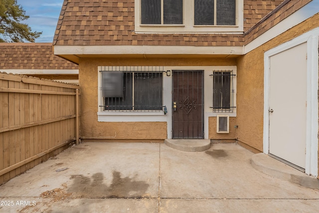 doorway to property featuring a patio area