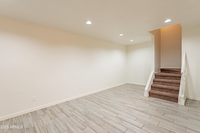 spare room with light hardwood / wood-style flooring