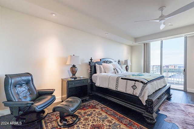 bedroom featuring dark wood-type flooring, access to outside, and ceiling fan