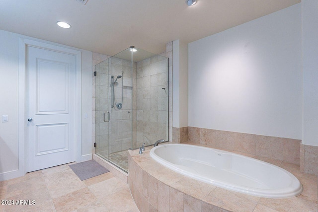 bathroom with tile patterned floors and separate shower and tub