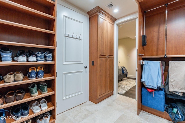 spacious closet featuring light wood-type flooring