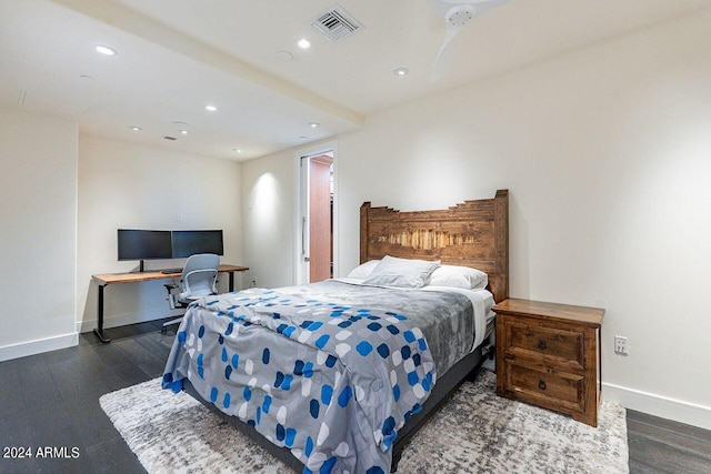 bedroom with dark hardwood / wood-style flooring