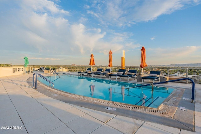 view of swimming pool with a patio