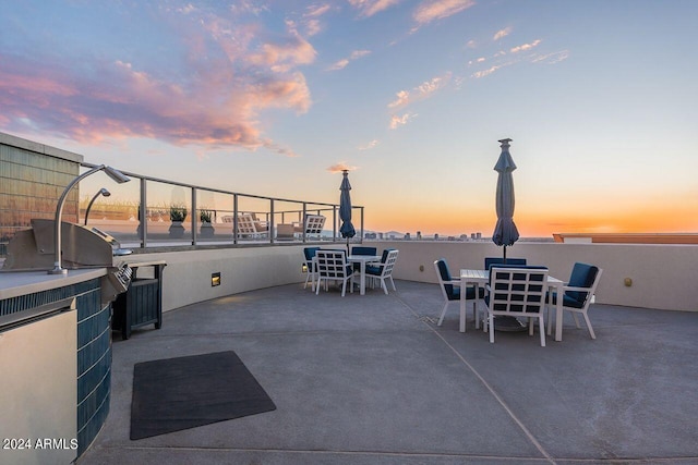 view of patio terrace at dusk