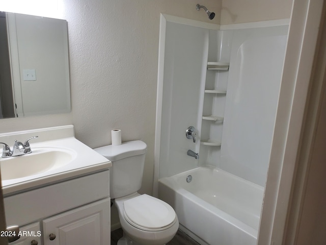 full bathroom featuring toilet, a textured wall, shower / tub combination, and vanity