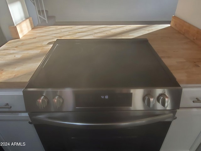 interior details featuring stainless steel electric range