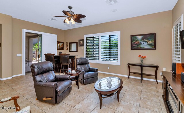 6133 W Fetlock Ter, Phoenix, AZ 85083 - living area with ceiling fan, light tile patterned floors, and baseboards