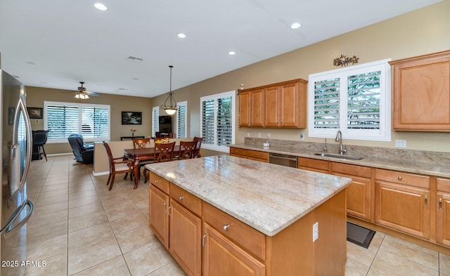 6133 W Fetlock Ter, Phoenix, AZ 85083 - kitchen featuring a sink, a center island, appliances with stainless steel finishes, light tile patterned flooring, and light stone countertops