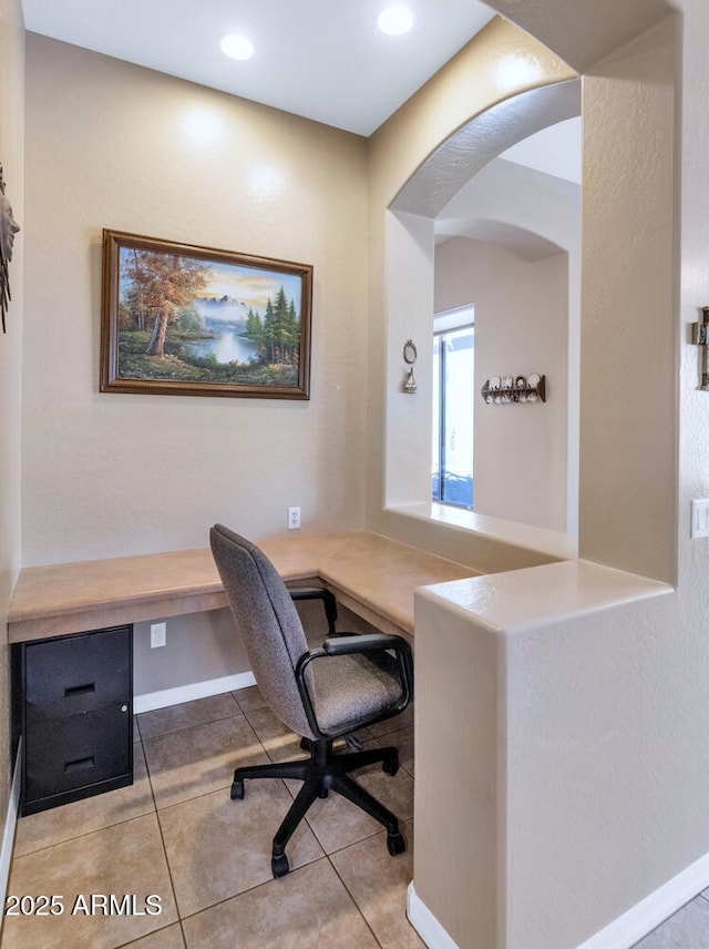 6133 W Fetlock Ter, Phoenix, AZ 85083 - tiled office with built in study area, arched walkways, baseboards, and recessed lighting
