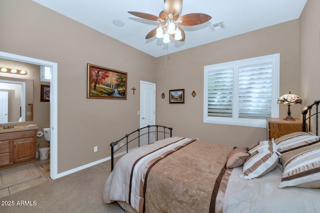 6133 W Fetlock Ter, Phoenix, AZ 85083 - bedroom with light carpet, a sink, baseboards, and connected bathroom