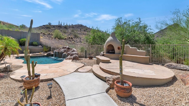 6133 W Fetlock Ter, Phoenix, AZ 85083 - view of swimming pool with a mountain view and a patio