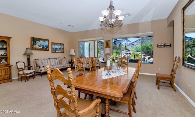 6133 W Fetlock Ter, Phoenix, AZ 85083 - dining room with carpet flooring, a chandelier, and baseboards