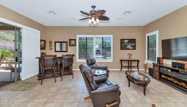 6133 W Fetlock Ter, Phoenix, AZ 85083 - living room with light tile patterned flooring, ceiling fan, and baseboards