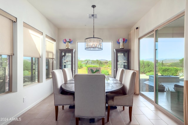 17756 E Silver Sage Ln, Rio Verde, AZ 85263 - dining area featuring a chandelier, light tile patterned floors, and baseboards