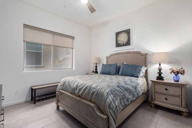 bedroom with tile patterned flooring and ceiling fan