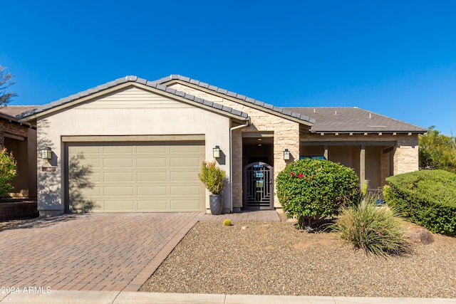 17756 E Silver Sage Ln, Rio Verde, AZ 85263 - ranch-style house featuring a garage, decorative driveway, stucco siding, stone siding, and a tile roof