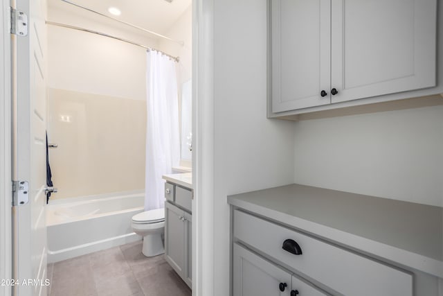 full bathroom featuring toilet, shower / tub combo with curtain, vanity, and tile patterned flooring