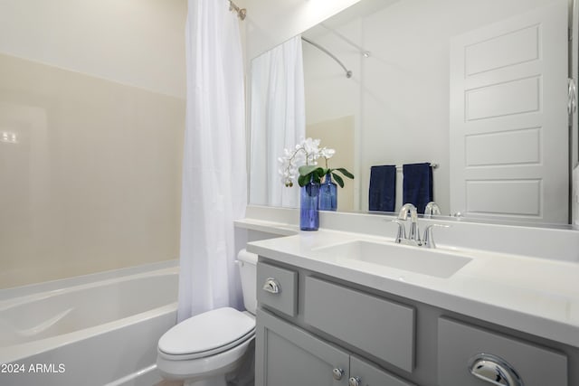 full bathroom featuring vanity, toilet, and shower / tub combo