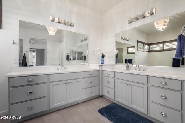 17756 E Silver Sage Ln, Rio Verde, AZ 85263 - bathroom with a chandelier, vanity, tile patterned floors, and a ceiling fan