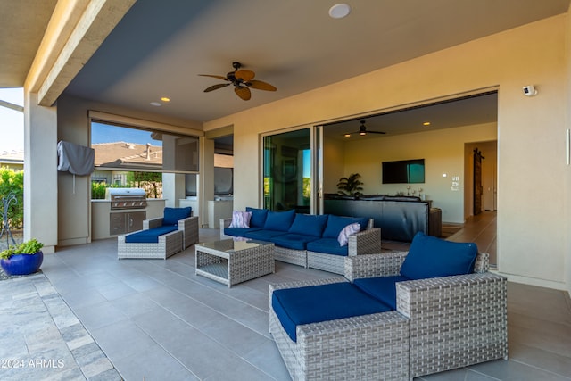 view of patio featuring an outdoor kitchen, an outdoor living space, area for grilling, and ceiling fan