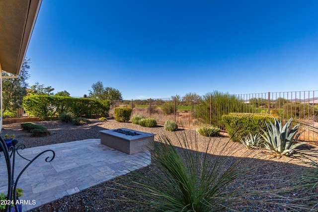 view of yard with a patio area and an outdoor fire pit