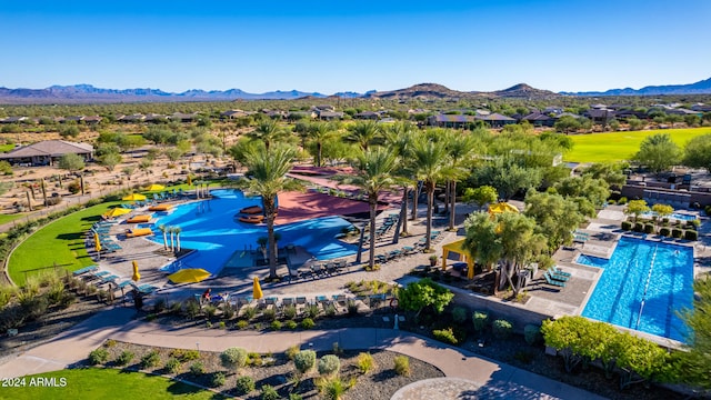 birds eye view of property featuring a mountain view