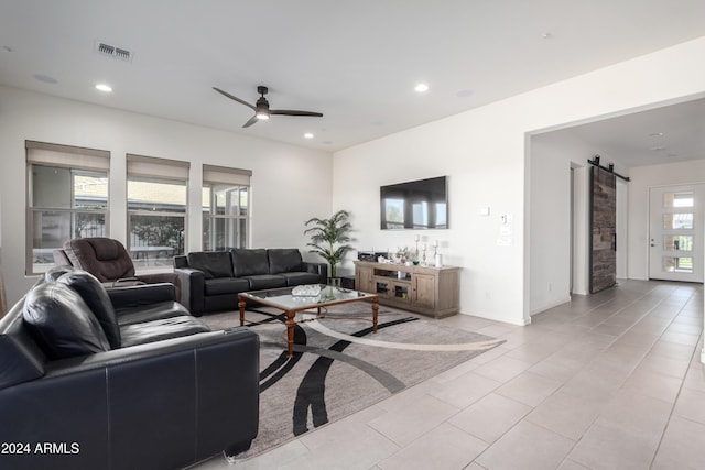 17756 E Silver Sage Ln, Rio Verde, AZ 85263 - living room with a barn door, ceiling fan, light tile patterned floors, and recessed lighting