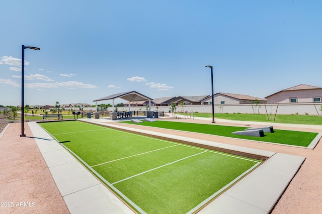 view of home's community featuring fence, a gazebo, and a residential view