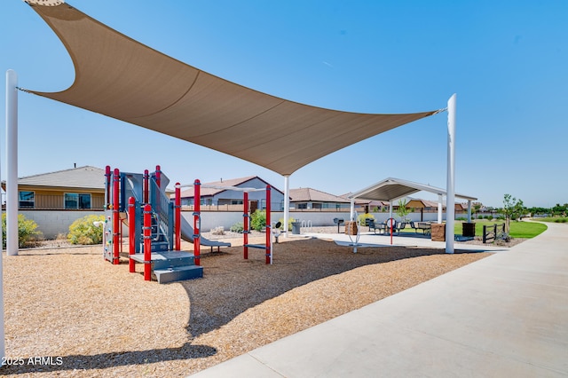 community playground featuring a gazebo and a residential view