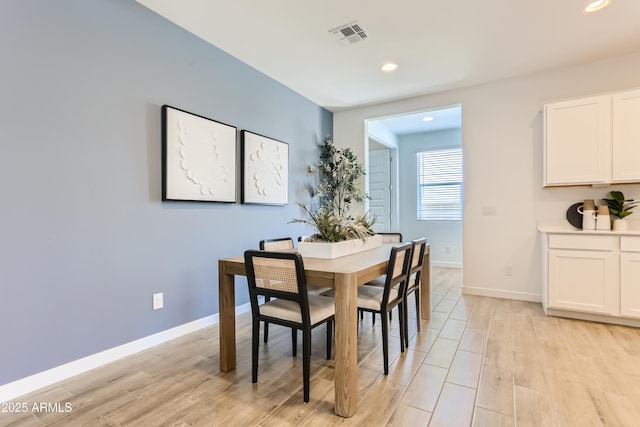 dining room featuring recessed lighting, visible vents, light wood finished floors, and baseboards