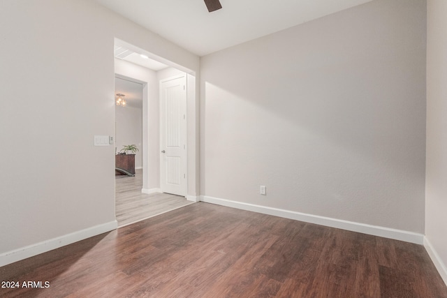 spare room with hardwood / wood-style flooring and ceiling fan