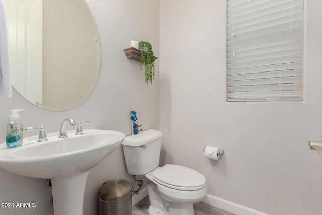 bathroom with toilet and sink