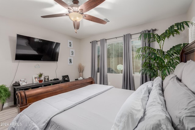 bedroom featuring ceiling fan and light hardwood / wood-style flooring