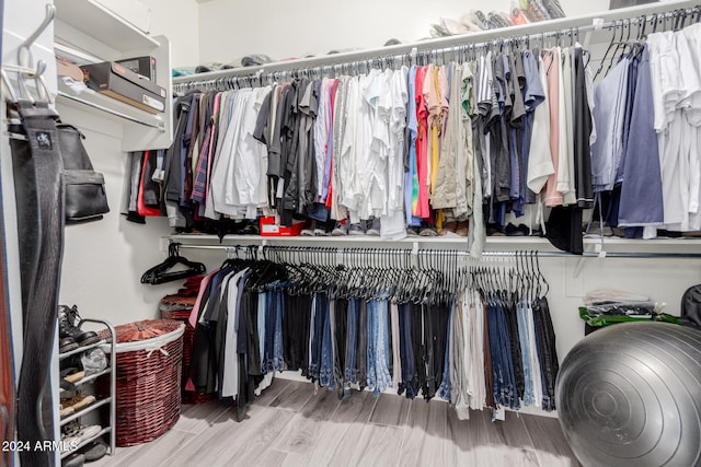spacious closet featuring hardwood / wood-style floors
