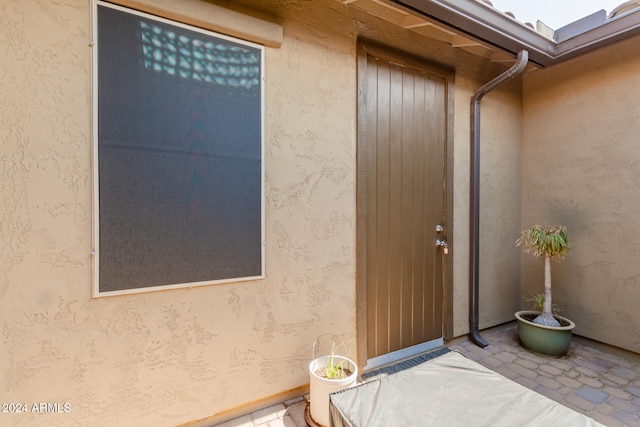 doorway to property with a patio