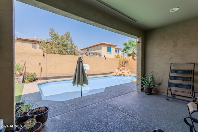 view of swimming pool with a patio